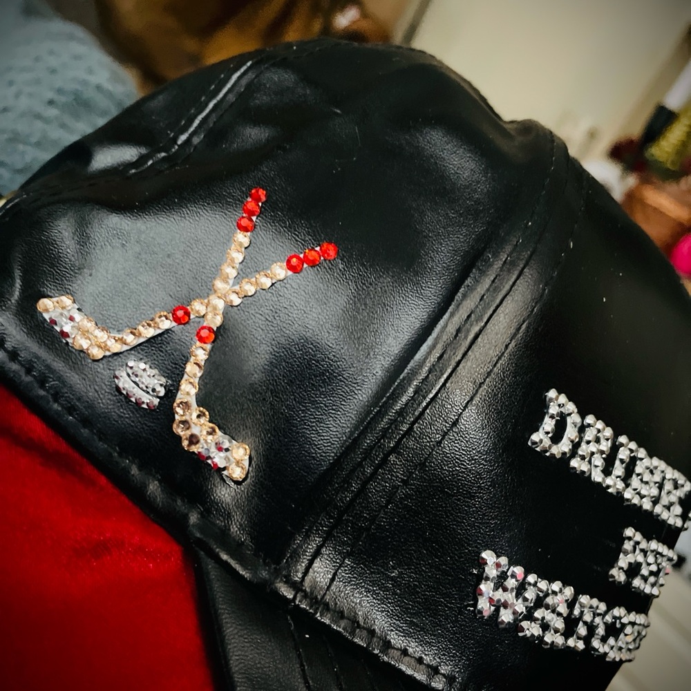 Embellished Black Leather Cap with Hockey Sticks